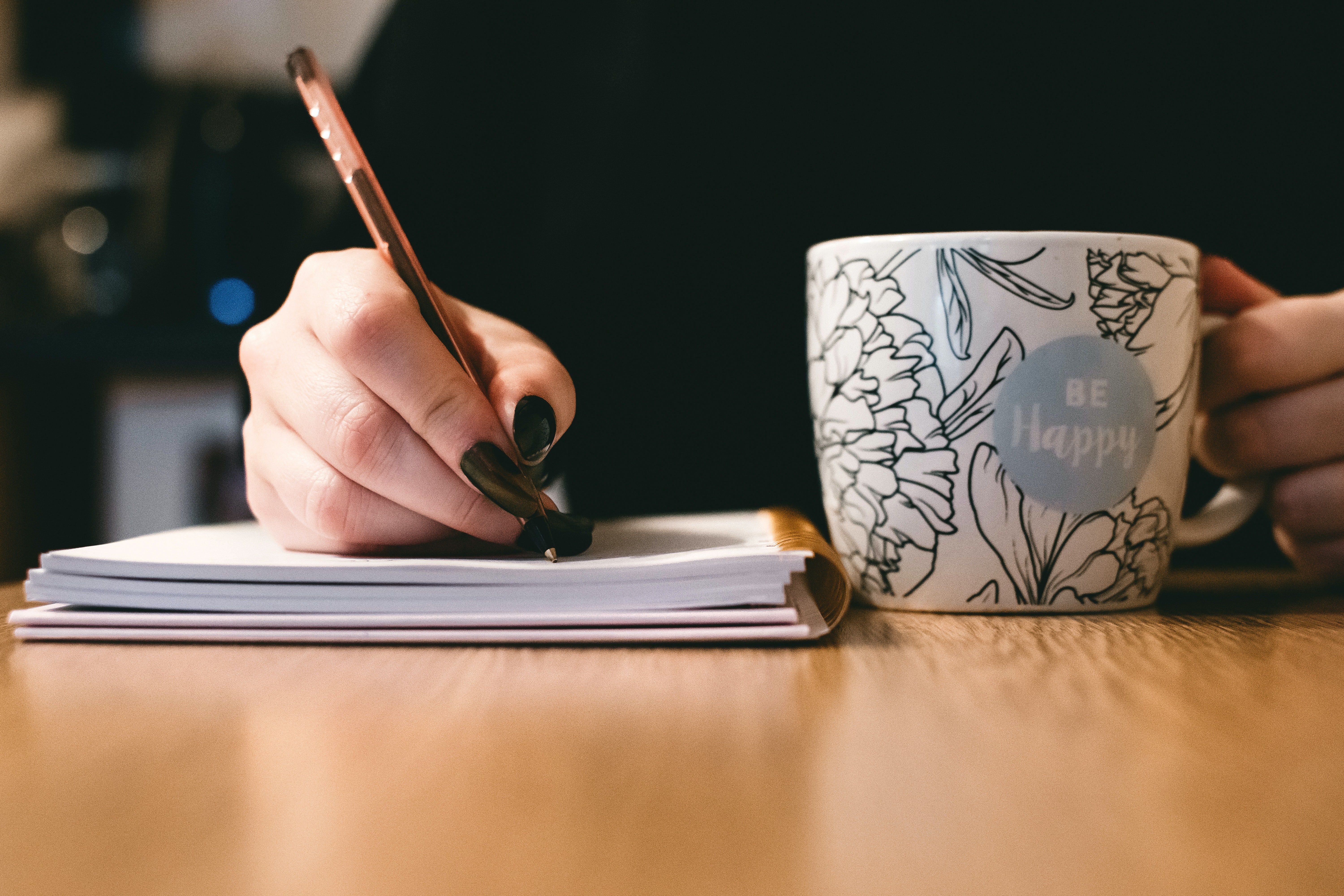 Woman writing about her feelings to get benefits of journaling